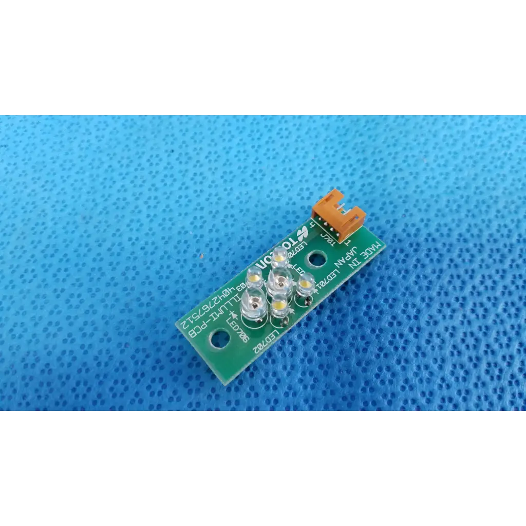 Green circuit board with five white led lights and orange connector for ILLUMI-PCB internal led illumination in Topcon camera