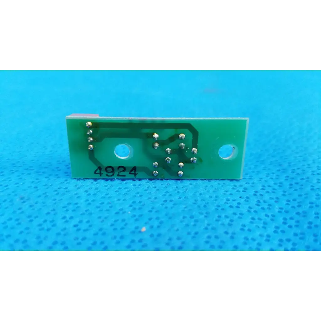 Green rectangular led illumination circuit board with silver solder points and two circular cutouts for topcon retinal camera