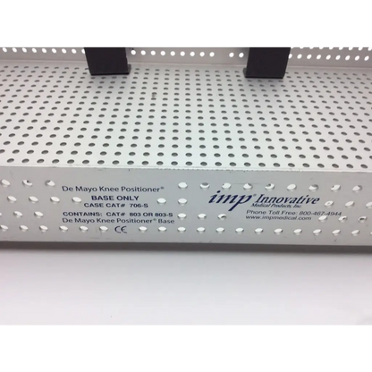 White perforated metal base for de mayo knee positioner in imp innovative 706-S small sterilization case