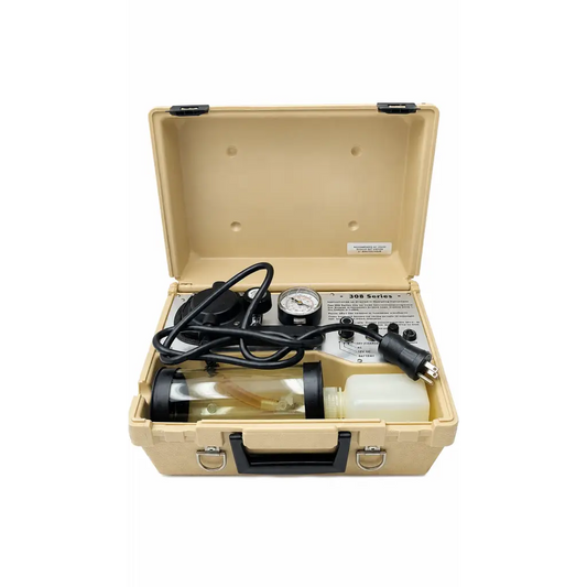 Beige hard-shell case with impact 308 series portable suction unit including black hoses and gauges