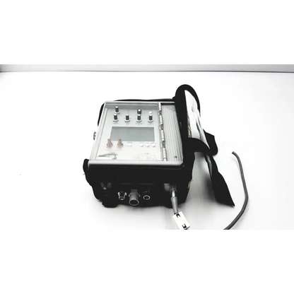 Silver metallic handheld portable ventilator by impact instrumentation with black carrying case and attached cables