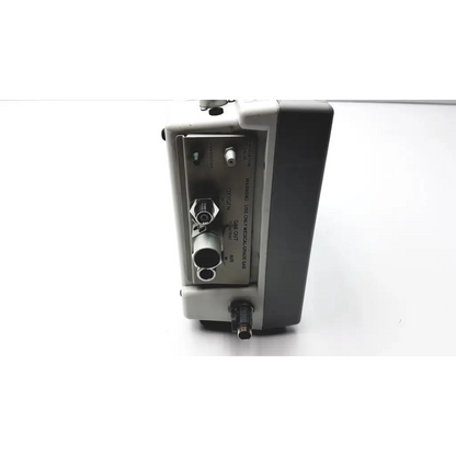 Gray and black industrial impact instrumentation uni-vent 754 portable ventilator with multiple ports and labeled connectors