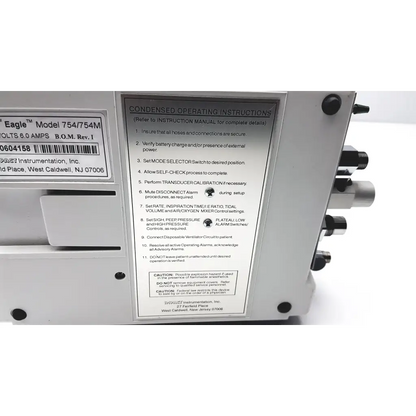 White plastic impact instrumentation portable ventilator labeled eagle model 754 with barcode for medical use