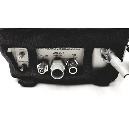 Black foam-lined medical gas delivery ports on the back of impact instrumentation portable ventilator uni-vent 754