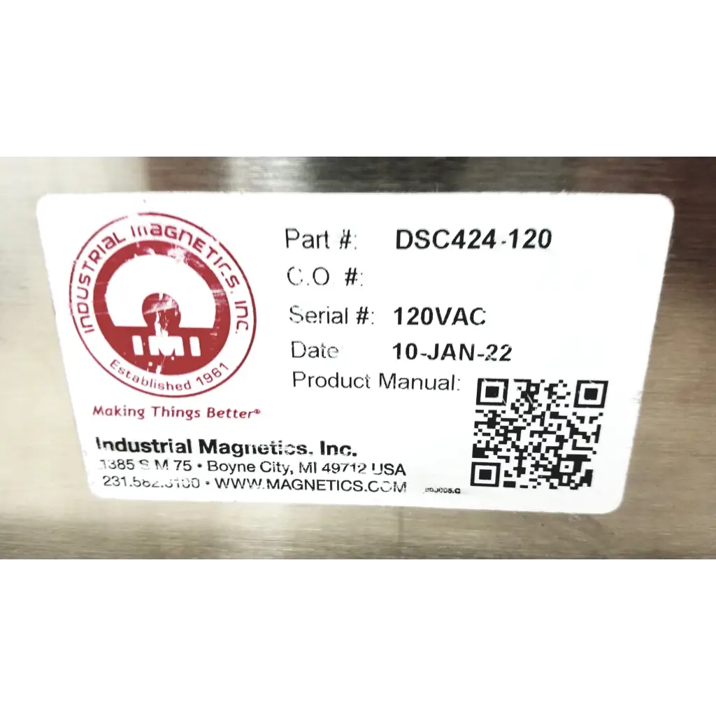 White label with red circular logo and black text on metallic surface of industrial magnetics imi dsc424-120 demagnetizer