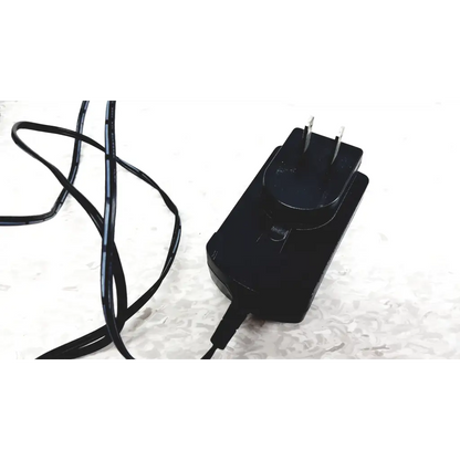 Black plastic power adapter with coiled cable and two-prong plug for industrial scientific ibrid mx6 multi gas monitor charger