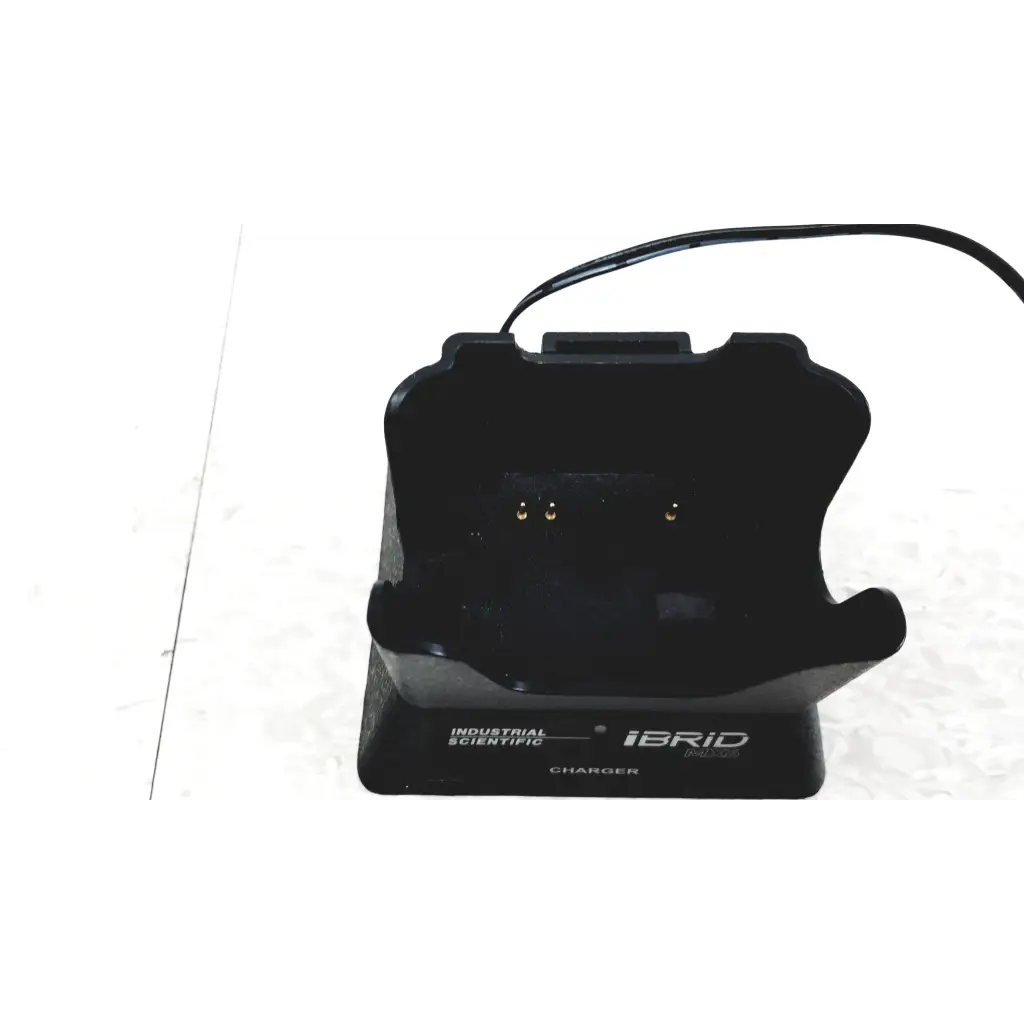 Black plastic charging dock labeled charger for industrial scientific ibrid mx6 multi gas monitor