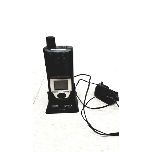 Black industrial scientific ibrid mx6 multi gas monitor with small screen and circular button on black charger base