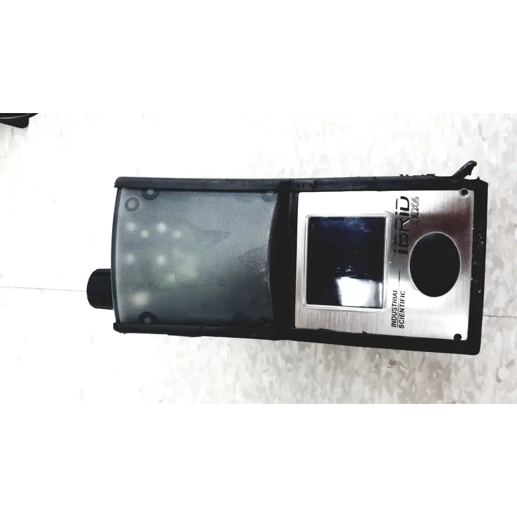 Black and silver industrial scientific ibrid mx6 multi gas monitor with transparent display cover and charger