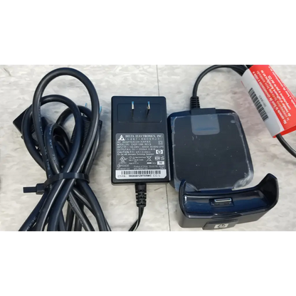 Black plastic delta electronics ac adapter with coiled cord and blue phone dock in innov-x systems analyzer spectrometer kit