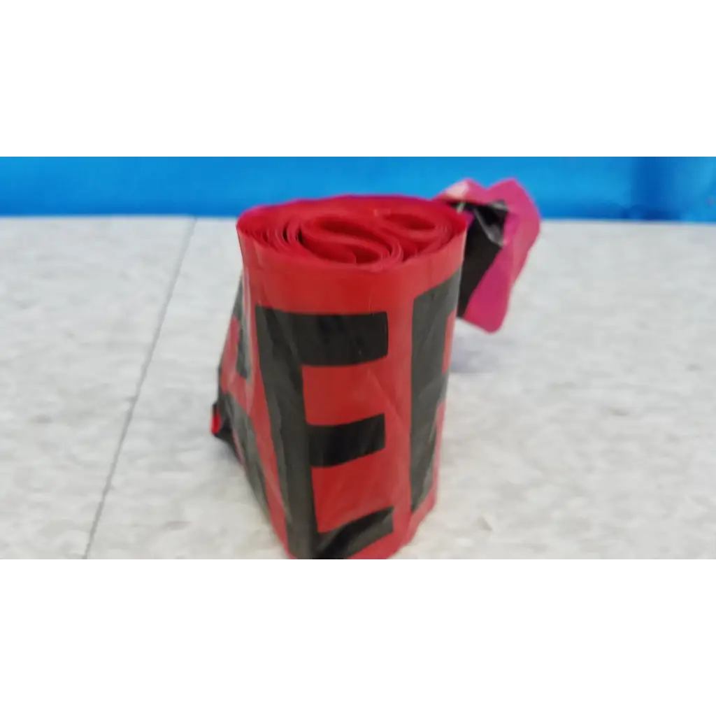 Red and black striped duct tape roll with pink tab included in Innov-X Systems a-4000 S alpha handheld analyzer spectrometer kit