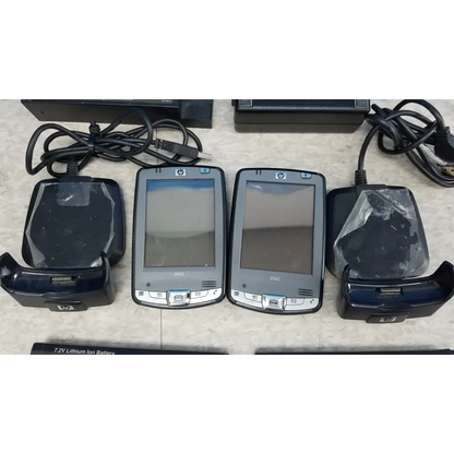Two silver hp ipaq handheld devices with black charging docks in innov-x systems a-4000 s alpha handheld analyzer spectrometer kit