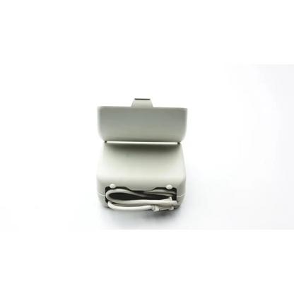 Light gray plastic charging dock with white cable neatly stored inside for inspiration respironics nebulizer af5-5 2923sm