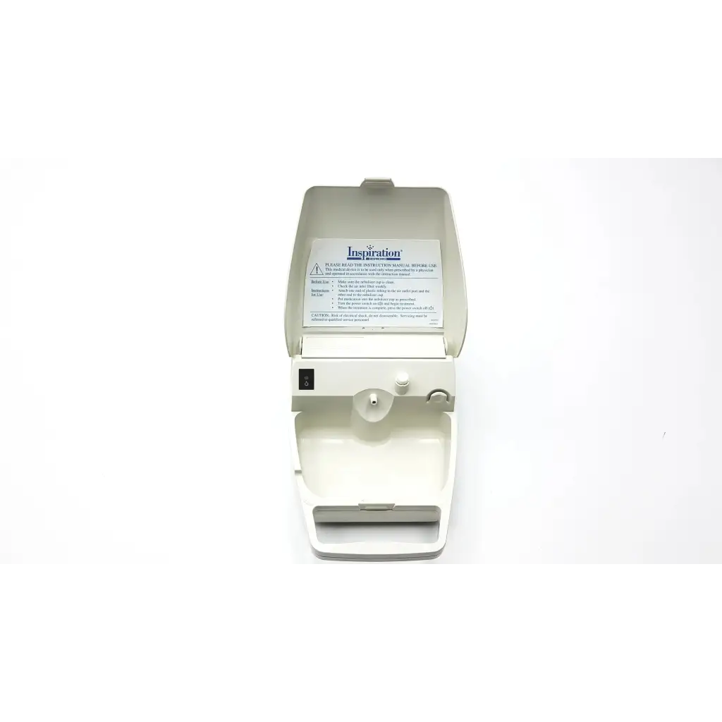 White plastic inspiration respironics nebulizer af5-5 2923sm dental handpiece with control buttons and label