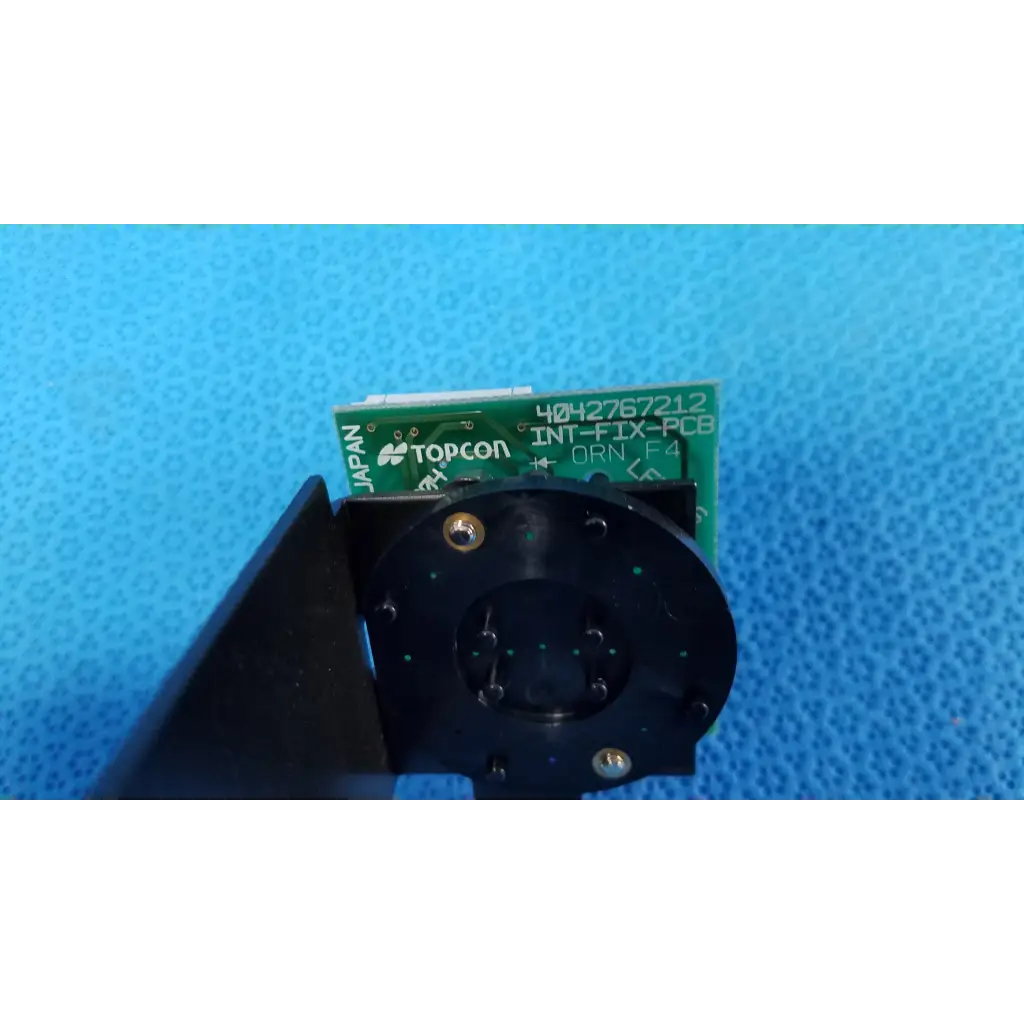 Green Topcon INT-FIX-PCB internal fixation target circuit board with black mounting bracket for retinal camera use