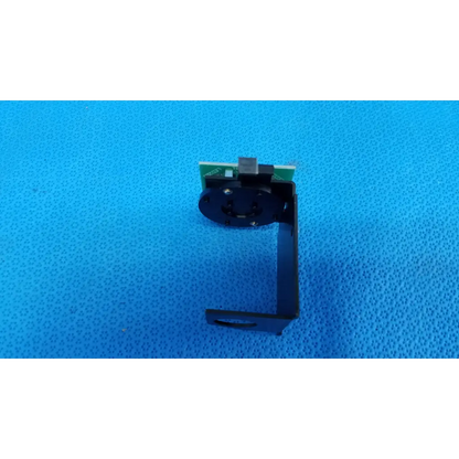 Black metal camera mount with green circuit board for internal fixation target on topcon trc-nw6s retinal camera