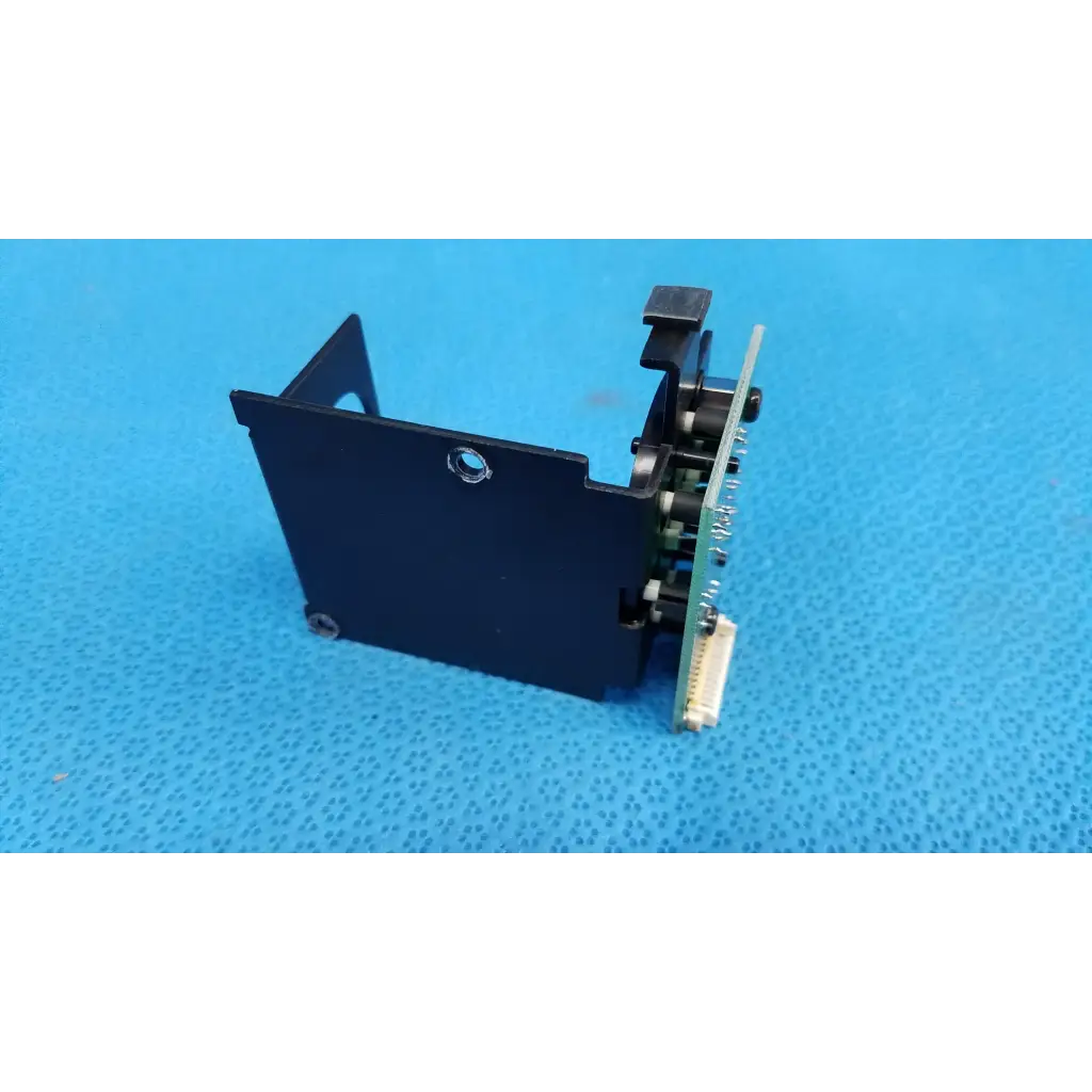 Black plastic housing with integrated circuit board and mechanical parts for internal fixation target in topcon retinal camera