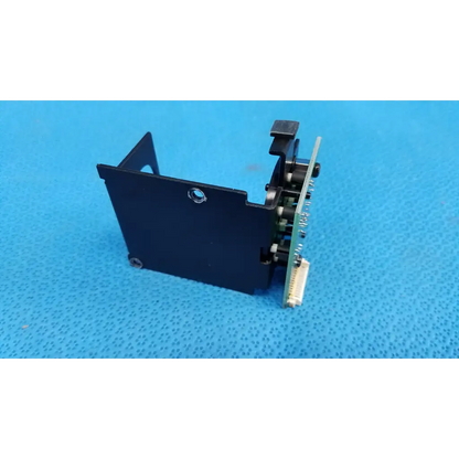 Black plastic housing with integrated circuit board and mechanical parts for internal fixation target in topcon retinal camera