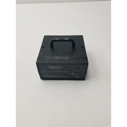 Black rectangular integra padc-ft dermatome power supply unit with top handle and labeled ports for electric dermatome use