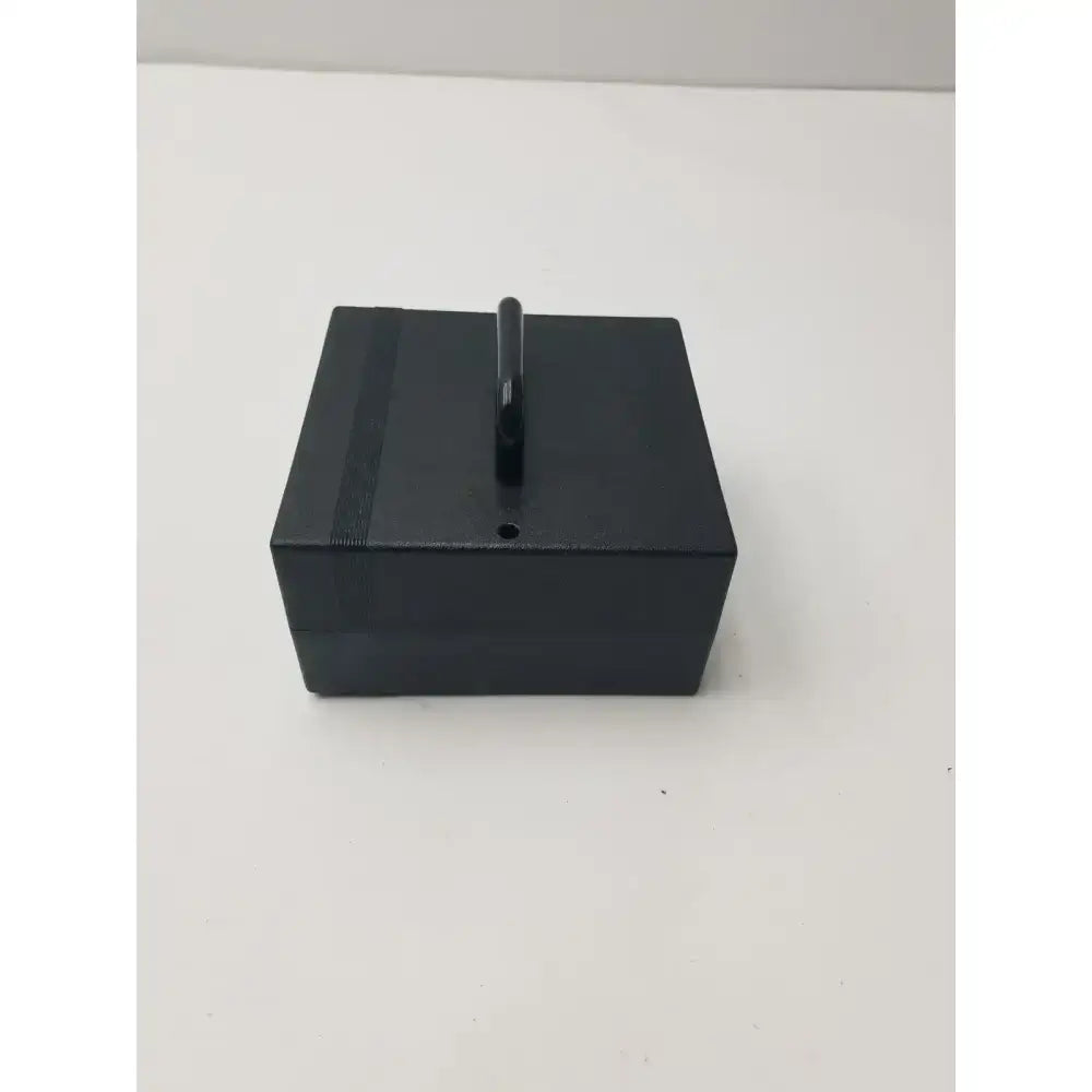 Black rectangular display stand with vertical handle for integra padgett model s electric dermatome power supply unit