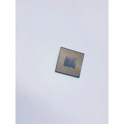 Square-shaped intel core i5-520m 2.4ghz socket g1 laptop cpu with gold pins and dark gray central die back side view
