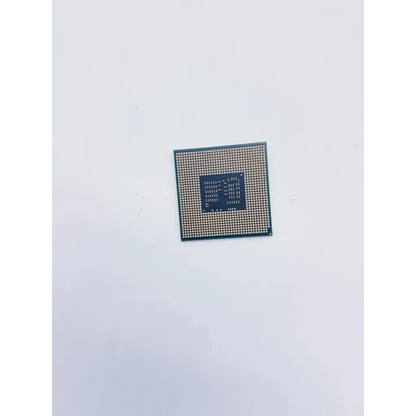 Intel core i5-520m socket g1 laptop cpu with green circuit board gold pins and dark blue central square processor