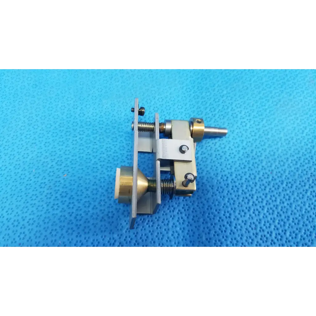 Silver and brass mechanical assembly with plunger pin and threaded rods for main unit locking knob of topcon retinal camera