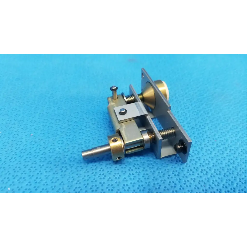 Metallic brass and silver-toned mechanical assembly with main unit plunger pin and spring for topcon trc-nw6s locking knob