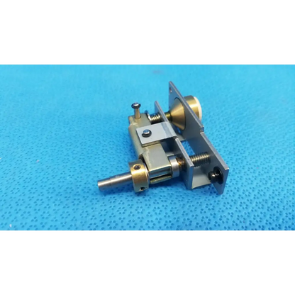 Metallic brass and silver-toned mechanical assembly with main unit plunger pin and spring for topcon trc-nw6s locking knob