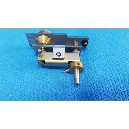 Metallic mechanical assembly with brass and silver-toned plunger pin and adjustment screws for topcon main unit