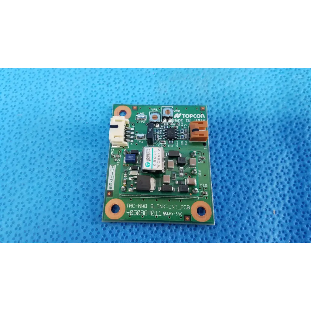 Green printed circuit board with orange mounting holes for internal blink control circuit board used in topcon trc-nw8