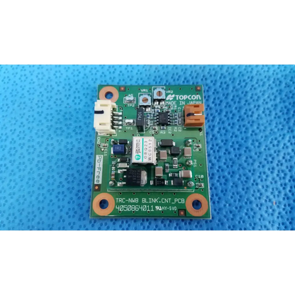 Green rectangular blink control circuit board labeled topcon trc-nwb blink control for retinal camera use