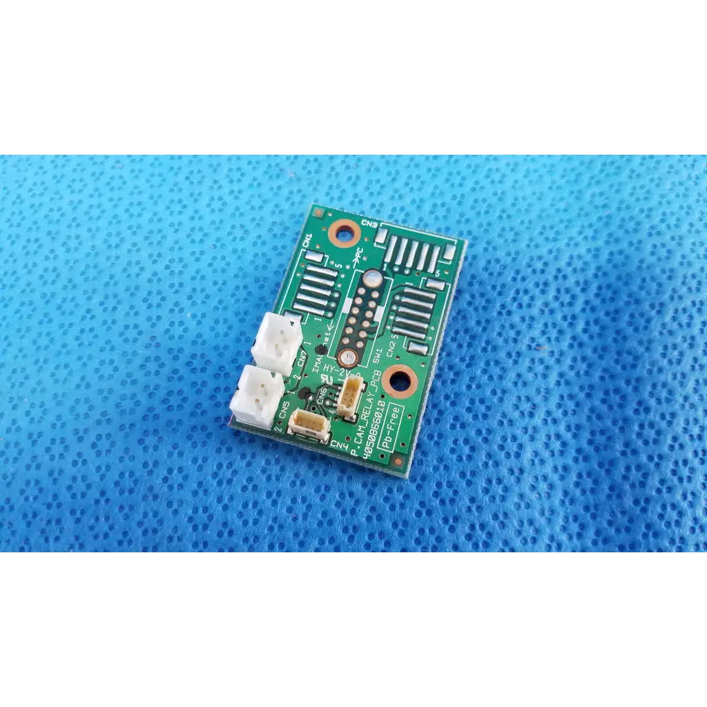 Green rectangular internal camera relay connection pcb board with white connectors and black components for topcon fundus camera