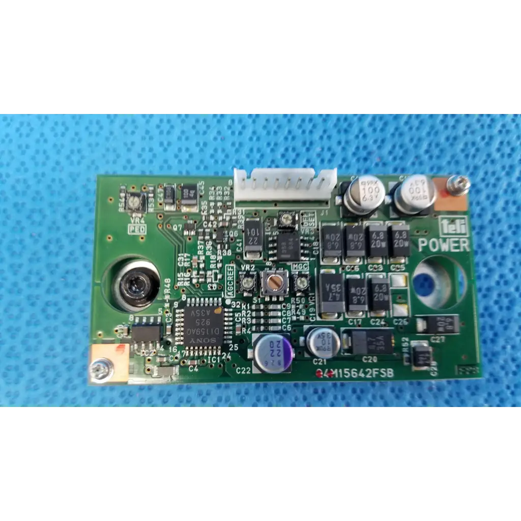 Green rectangular internal ccd camera power control board labeled teli power model m15642fsb for topcon camera