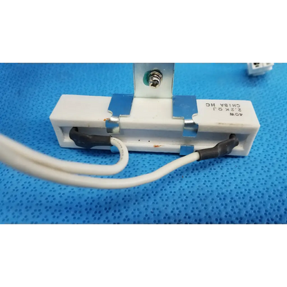 White ceramic power resistor with metallic terminals and black insulated wires for topcon fundus retinal camera