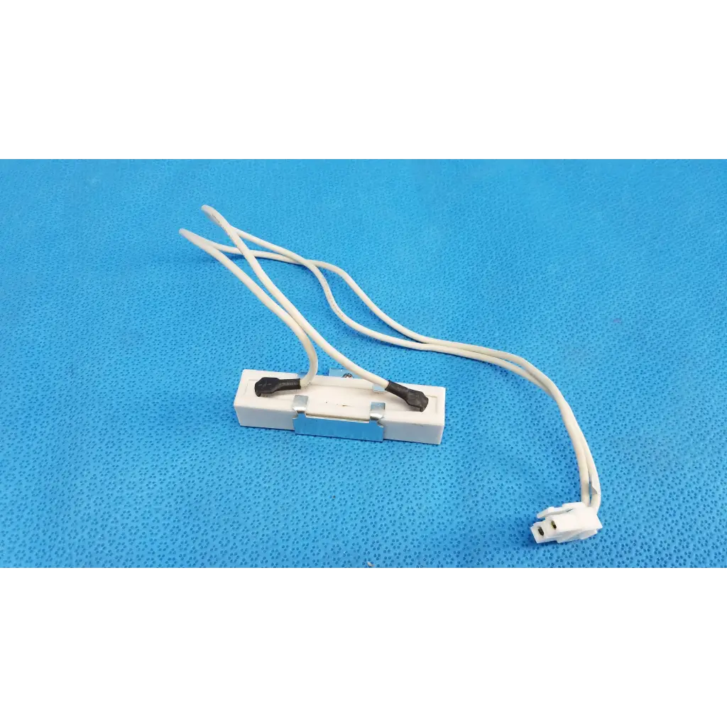 White plastic light fixture connector with black terminal caps and bundled wires for ceramic power resistor fundus retinal camera