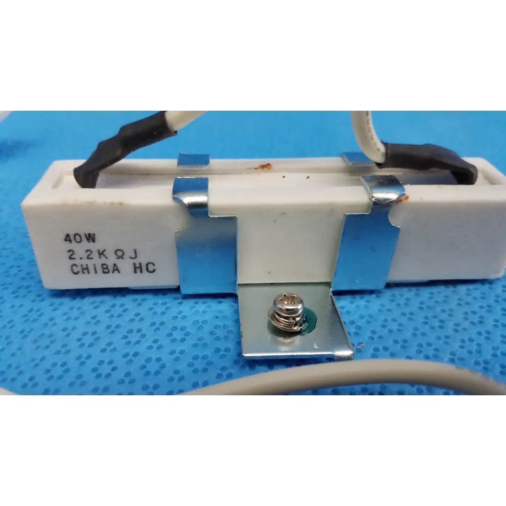 White ceramic power resistor with silver clamps and black wires labeled 40w 2.2k ohm for fundus retinal camera use