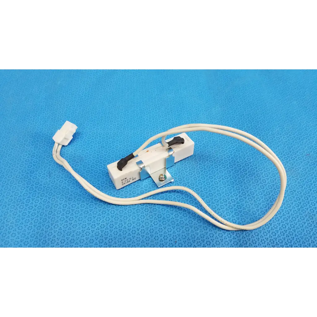 White plastic and metal thermal fuse with black lever and white wire for ceramic power resistor in fundus retinal camera