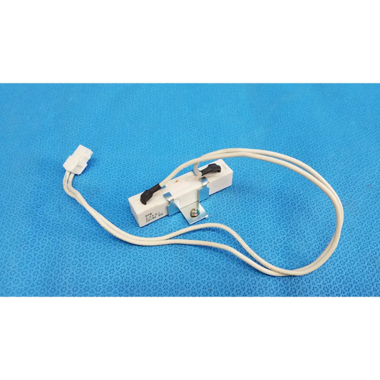 White plastic and metal thermal fuse with black lever and white wire for ceramic power resistor in fundus retinal camera