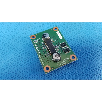 Green printed circuit board with black integrated circuits and silver capacitors for topcon chinrest motor driver pcb