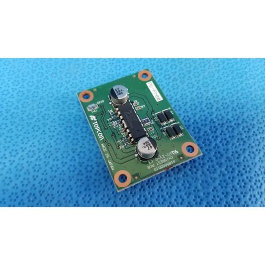 Green printed circuit board with black integrated circuits and silver capacitors for topcon chinrest motor driver pcb