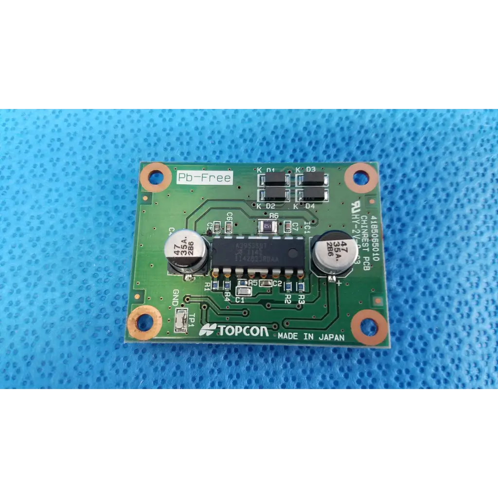 Green rectangular motor driver pcb board with black integrated circuits and capacitors for topcon chinrest motor
