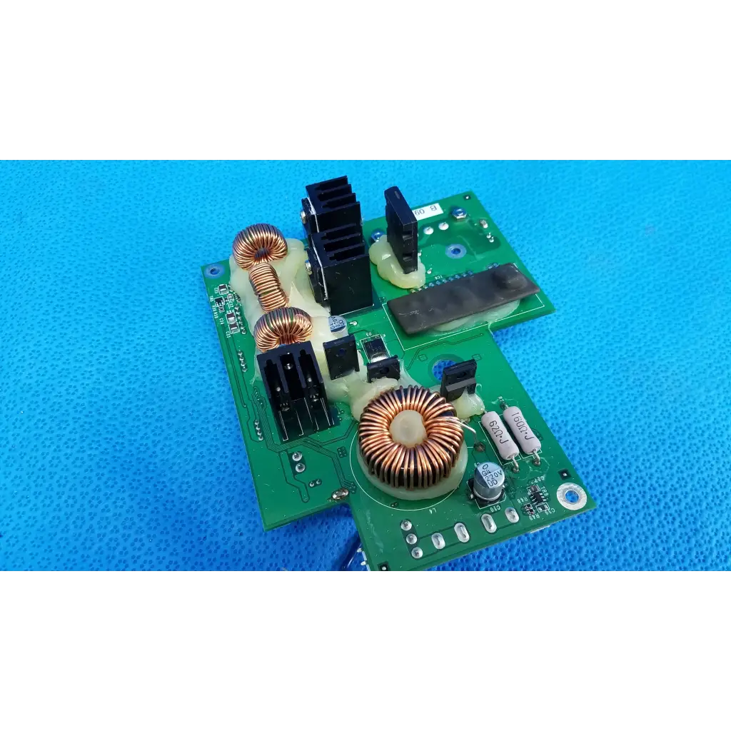 Green power pcb with copper coils and black heat sinks for internal dc power in topcon trc-nw8 fundus camera