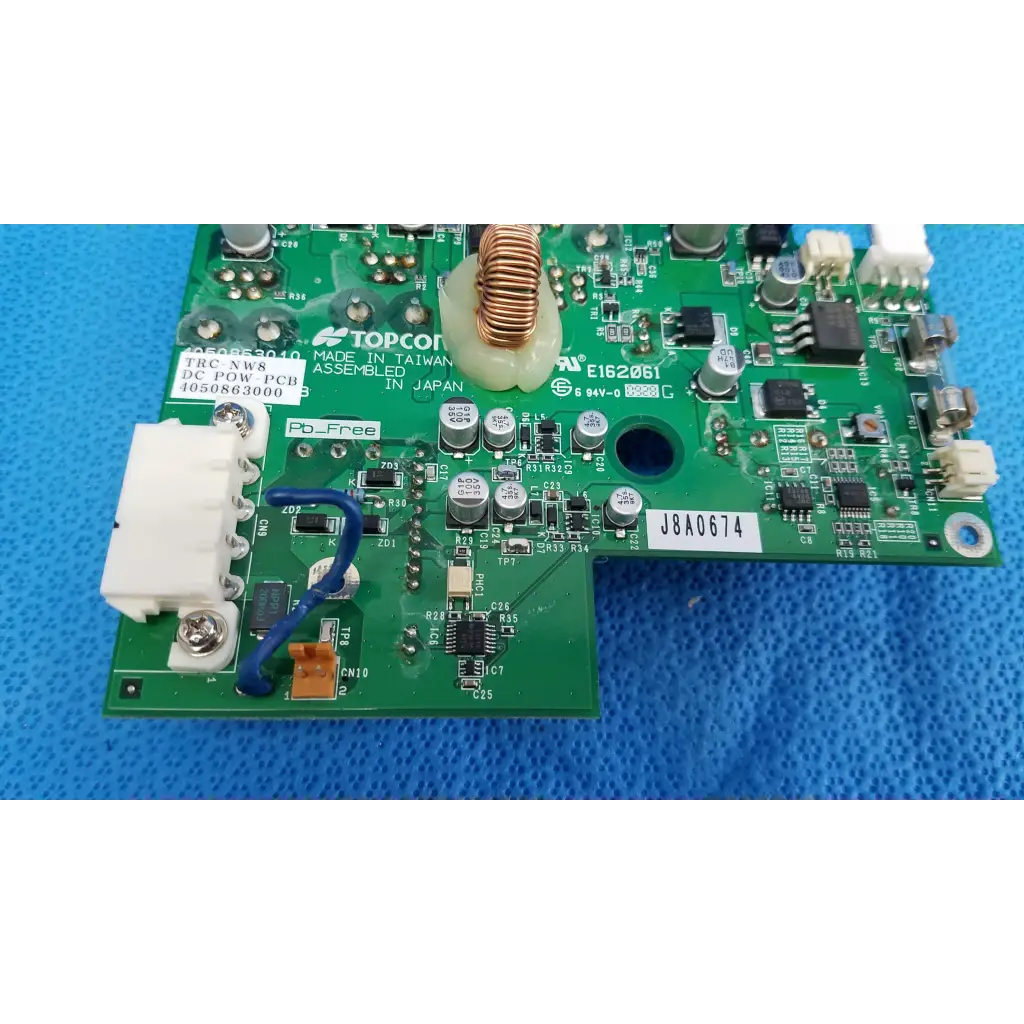 Green internal dc power pcb with electronic components and white labeling for topcon trc-nw8 fundus camera power pcb