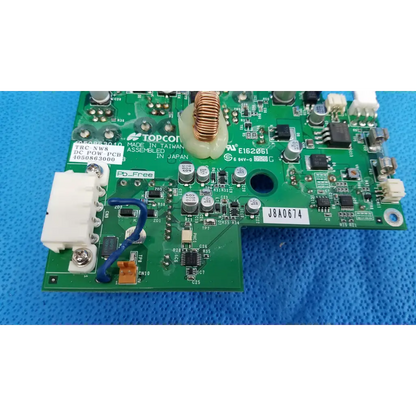 Green internal dc power pcb with electronic components and white labeling for topcon trc-nw8 fundus camera power pcb