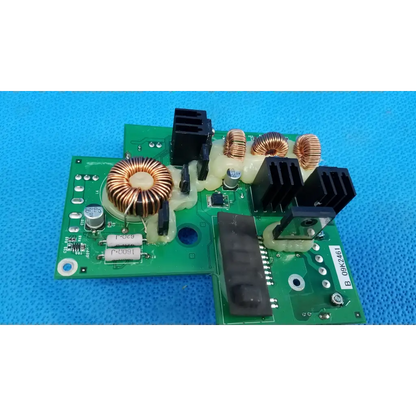 Green printed circuit board with copper coils and black heat sinks for internal dc power pcb in topcon fundus camera