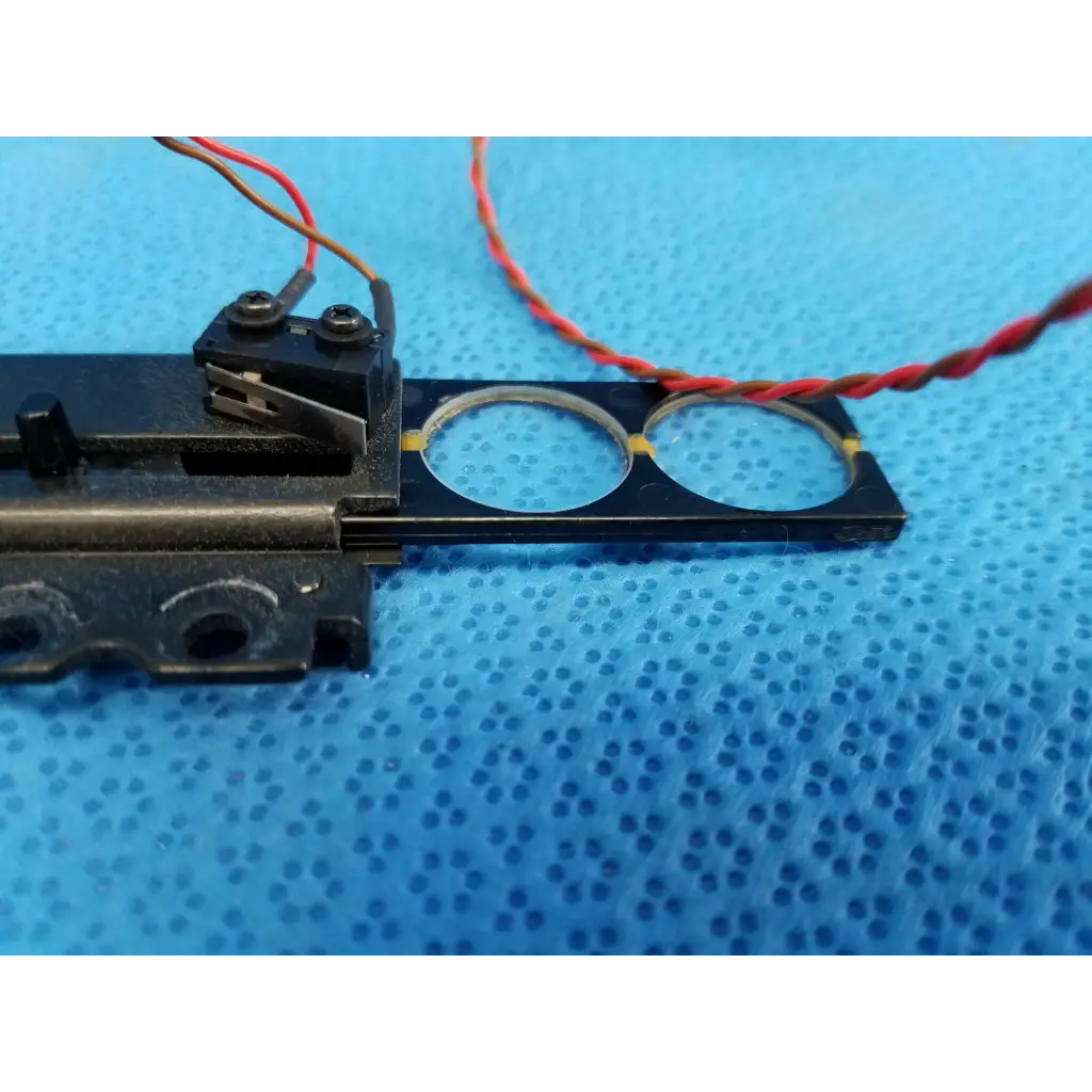 Black plastic internal diopter slider lens with two circular cutouts and wire harness for topcon TRC-NW8 retinal camera
