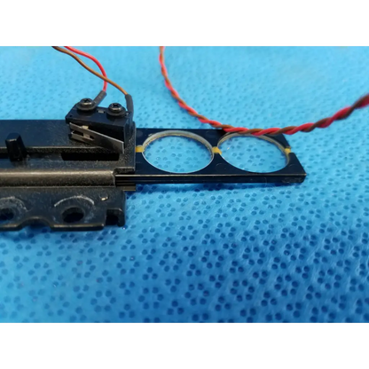 Black plastic internal diopter slider lens with two circular cutouts and wire harness for topcon TRC-NW8 retinal camera