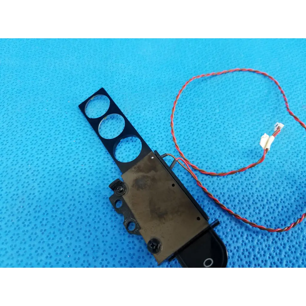 Black plastic and metal internal diopter slider lens part with three circular cutouts and red wire for topcon trc-nw8 retinal camera