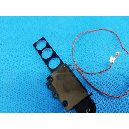 Black plastic and metal internal diopter slider lens part with three circular cutouts and red wire for topcon trc-nw8 retinal camera